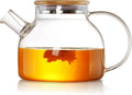 Tea pot transparent with wooden lid